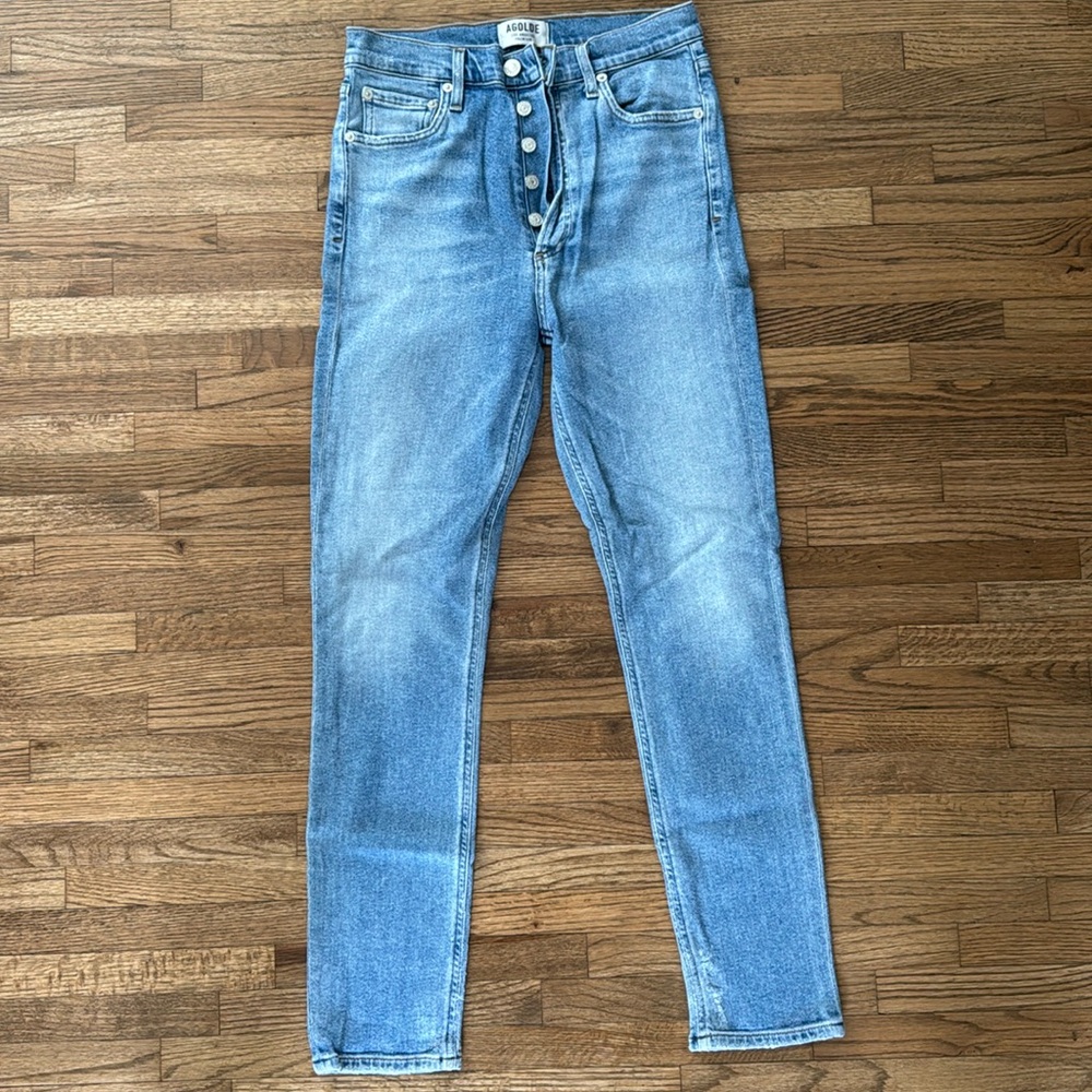 Light wash blue jeans with button fly